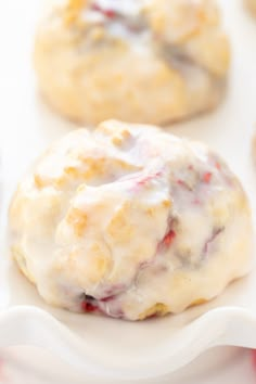 some cookies with icing on a white plate