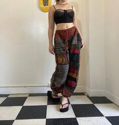 Bohemian mixed patchwork hippie pants in black/ mixed color patches. Each pair is slightly unique and will have some different patches and colorings! Pictures 1-3 are orange, green, and dark blue with mixed patches available in separate listings. Waist stretches from 24-35' inches comfortably. Model is 5'2 for reference. Black Patchwork Bottoms For Festival, Bohemian Black Patchwork Bottoms, Hippie Harem Bottoms With Patchwork, Hippie Style Patchwork Harem Bottoms, Hippie Patchwork Harem Bottoms, Hippie Patchwork Bottoms For Festival, Hippie Festival Pants With Patchwork, Hippie Patchwork Pants For Festival, Black Hippie Harem Bottoms