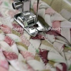 the sewing machine is stitching fabric together