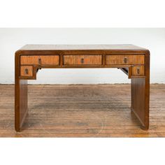 a wooden desk with two drawers on it