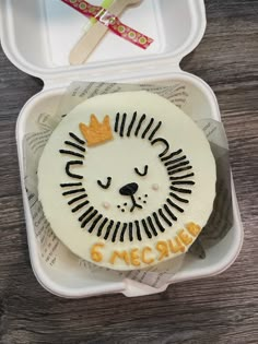 a container with a cake in the shape of a lion