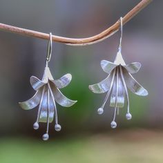 Handcrafted from sterling silver, two flowers bloom beautifully. Desi Antari in Bali creates these earrings, accenting them with a brushed-satin finish that captures the light. Two Flowers, Handmade Silver Jewellery, Metalsmithing Jewelry, Silver Flower Earrings, Silver Earrings Handmade, Sterling Silver Drop Earrings, Flowers Bloom, Sterling Silver Dangle Earrings, Silver Jewelry Handmade