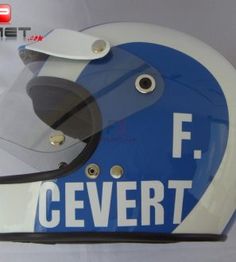 a helmet with the word cevertt on it is shown in white and blue