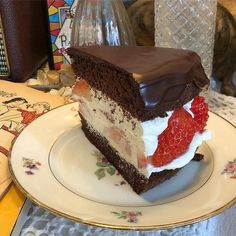 a piece of cake with chocolate and strawberries on it