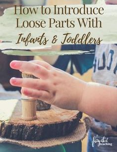 a person's hand on top of a piece of wood with the words how to introduce loose parts with inflatables and toddlers