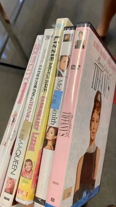 a stack of dvd's sitting on top of each other