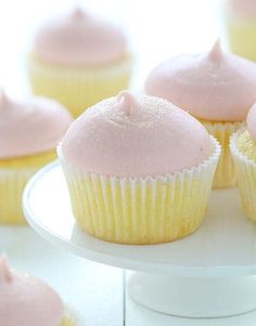 a magazine cover with pink frosted cupcakes on a white cake platter