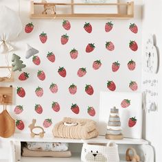 the wallpaper is decorated with strawberries and other things to decorate in this child's room