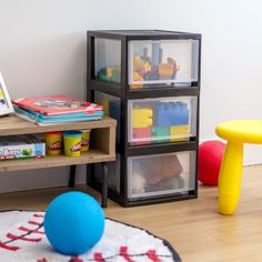 a room with toys and books on the floor