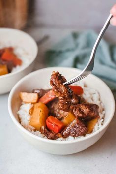 two bowls filled with meat and vegetables on top of rice