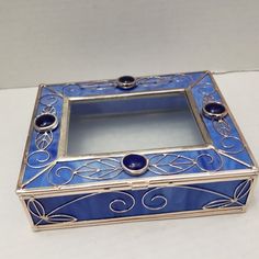 a blue and silver box sitting on top of a table