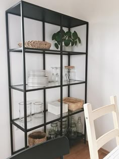 the shelves are filled with dishes and glassware