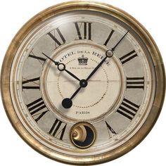 an old clock with roman numerals on the face is shown in gold and silver