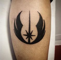 a star wars symbol tattoo on the leg