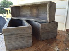 three wooden boxes sitting on top of a table