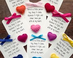 four cards with different colored hearts on them and some words written in white paper next to each other