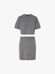 MO&Co. Women's Wool Blend Knit Skirt and Top Set This dress is crafted from a luxurious wool blend, ensuring durability and warmth. The front embroidered letter detail adds a touch of sophistication to the grey hue. it is cut with a cropped top and mini skirt, making it perfect for a chic and stylish ensemble. Features : - Set cut with cropped top and mini skirt- Front embroidered letter detail- Made from wool blend Code: MBD3DRS055The back length of skirt size S is 42.8cmMATERIALS & CARE Materi