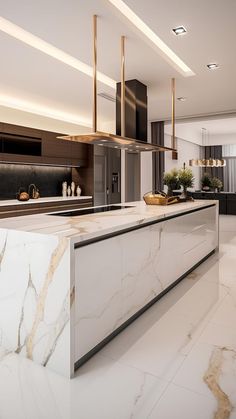 an elegant kitchen with marble counter tops and gold accents on the ceiling, along with modern lighting