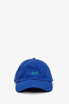 The Clare V. Oui Baseball Hat Features: A timeless baseball cap cut from cotton canvas and corduroy with adjustable metal slide closure. Featuring the French phrase Oui, translating to "Yes." Style: AC-HT-HT-100136-ROYBL Made in China / Embroidered in L.A. Min. Circumference: 22" Max Circumference: 24 ½" Brim: 2 ½" Adjustable Sliding Metal Closure One size fits most Spot Clean Images of the Royal Blue Baseball Hat Courtesy of Clare V. Blue Curved Brim Collegiate Hat, Collegiate Blue Baseball Cap With Curved Bill, Collegiate Blue Baseball Cap Fan Merchandise, Classic Blue Baseball Cap, Royal Blue Baseball Hat, Billy Reid, Metal Slide, Clare V., Ball Cap