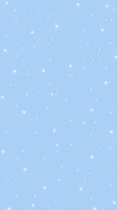 an airplane flying in the sky with snow flakes on it