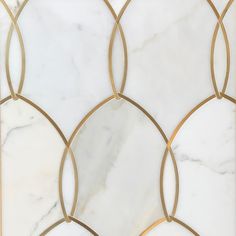 a white marble tile with gold accents