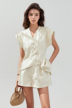 This two-piece set features a stylish waistcoat and shorts. The waistcoat has an irregular hem, V neckline, and front button closure, with short sleeves. The shorts are designed with a high-rise and pockets for convenience.Fabric: Cotton, Polyester Shorts Button Down Outfit, Stylish Waistcoats, Button Down Outfit, Simple Fits, Irregular Hem, Cute Fit, Minimalist Wardrobe, Cotton Set, Street Style Inspiration