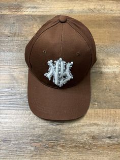 Custom NY Pearl Hat 🤎🤍 Made w/love I don't accept any exchanges or returns but if you have any issues with your order, please message me Thank you so much:). Hat With Pearls, Pearl Hat, Ny Hat, I Thank You, Hat Making, Trucker Cap, Caps Hats, Accessories Hats, Accessory Gift