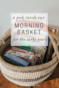 a basket filled with books on top of a wooden table