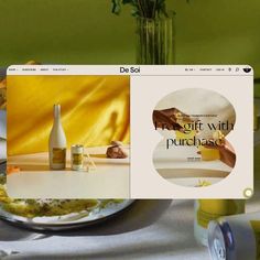 an image of a web page with food and wine on the table in front of it