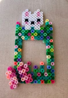 the letter h made out of plastic beads