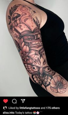 a woman with a tattoo on her arm is holding a book and flowers in her hand