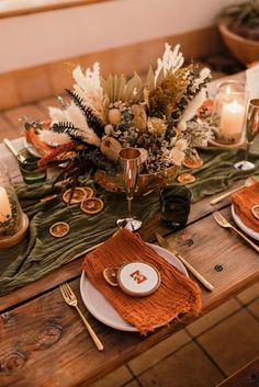 tablescape olive green runner, burnt orange napkins with dried oranges and gold accents Emerald Green And Burnt Orange Wedding Tables, Round Table Wedding Decor Burnt Orange, Green And Brown Centerpieces, Rust Olive Green Wedding, Burnt Orange Green Brown Wedding, Green Gold Terracotta Wedding, Mustard Sunset Terracotta Rust Sage Olive, Rust Beige Sage Green Centerpieces, Orange And Green Event Decor