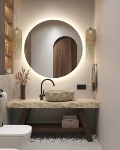 a bathroom with a round mirror above the sink and lights on the wall behind it