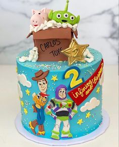 a birthday cake with toy story characters on the top and stars in the sky around it