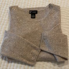 All That Glitters Is Gold Tan/ Taupe Cashmere Round Neck, Long Sleeved Sweater. This Beautiful Sweater Is Full Of Sparkle. Perfect To Dress Up Jeans - But The Neutral Tan Color Makes This Sweater Easy To Pair With Anything! Medium Weight Is Perfect Winter, Spring And Fall. Timeless In Style. Love This Sweater But It’s Too Big For Me. Excellent - Like New Condition. Fragrance Free. Size Xl. Approx 21” Pit- Pit Approx Length 25” Dress Up Jeans, All That Glitters Is Gold, Beautiful Sweater, Tan Color, Spring And Fall, Cashmere Sweaters, Fragrance Free Products, Long Sleeve Sweater, Round Neck