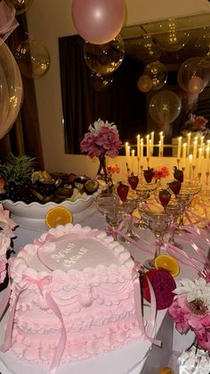 a table topped with lots of cakes and desserts