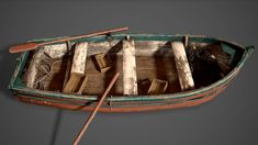 an old wooden row boat with two oars and books in the front, on a gray background