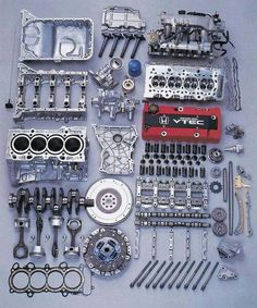 an assortment of engine parts displayed on a blue background