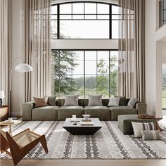 a living room filled with lots of furniture next to a large window covered in curtains