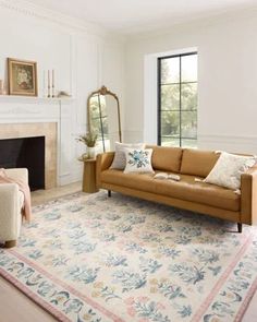 a living room filled with furniture and a fire place