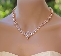 "Rose Gold 'Colette' bridal necklace is made with stunning marquise cut and teardrop crystals, and is completed with a starburst of crystals at the center. Colette has the most gorgeous sparkle and will add an elegant and very sophisticated touch to your wedding day jewels. Perfect if you are wearing a strapless dress! Measures: L = 16\" (40.5 cm) with an optional 2\" extender. Width = 1cm Center piece = 3cm long Highest quality cubic zircons set in tarnish resistant 16K Rose gold plate for heir Rose Gold Jewelry Necklace, Gold Jewelry Wedding, Crystal Wedding Necklace, Promise Necklace, Gold Bridal Necklace, Diamond Necklace Designs, Bridal Necklace Set, Necklace Rose Gold, Rose Gold Bridal