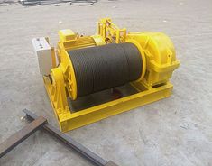 an electric winch is sitting on the ground