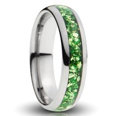 a ring with green stones inlayed into it