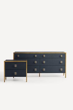 two black and gold dressers side by side