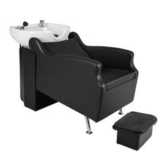 a black chair with a white sink and footstool