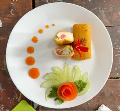 a white plate topped with food on top of a wooden table