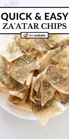 a white plate topped with pasta and seasoning next to the words zaatar pita chips