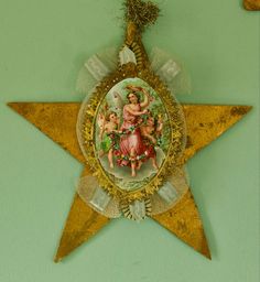 a decorative star hanging on the side of a wall