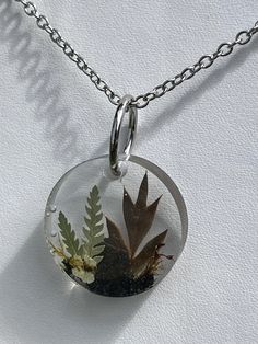 Handmade terrarium necklace featuring real hand-foraged and preserved plants harvested from Maine Forests.  18" Stainless Steel Chain Epoxy Crafts, Terrarium Jewelry, Terrarium Necklace, Steel Chain, Stainless Steel Chain, Resin Crafts, Last Minute Gifts, Terrarium, Jewelry Necklace Pendant