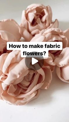 some pink flowers with the words how to make fabric flowers? on top of them